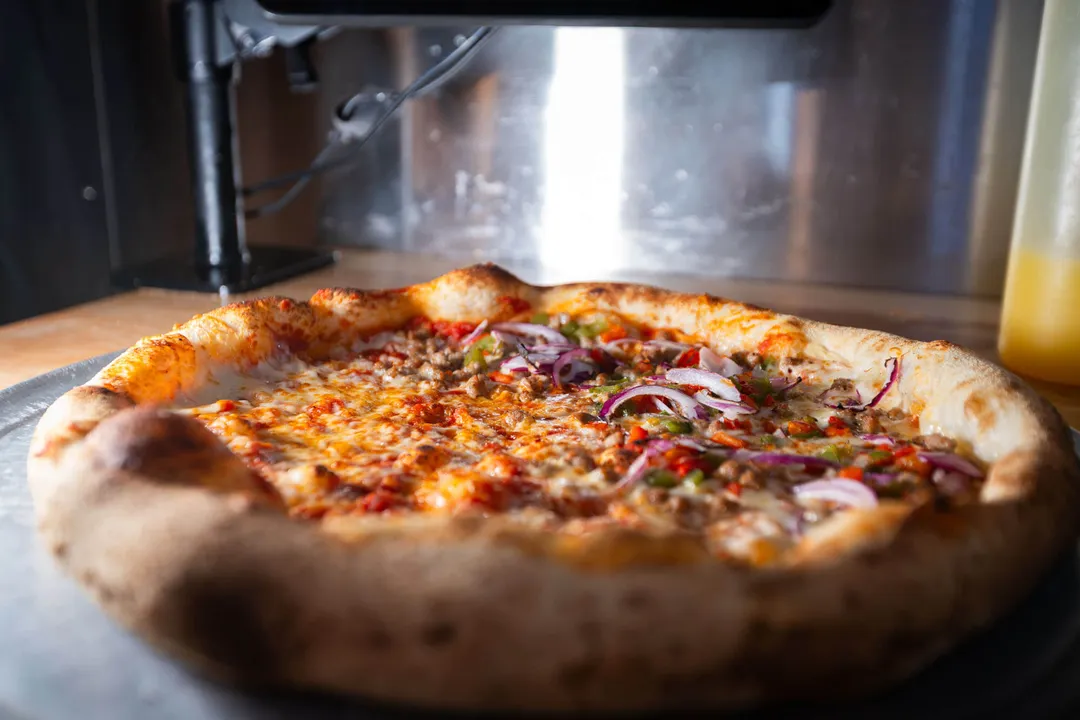 A hand-tossed supreme pie