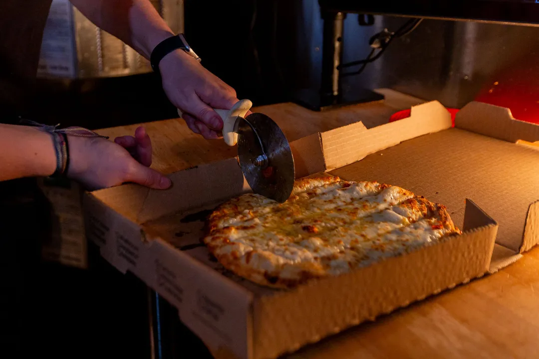 A finished pie being cut on the line