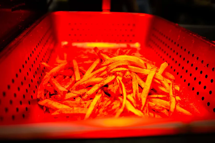 Loaded fries under the warmer