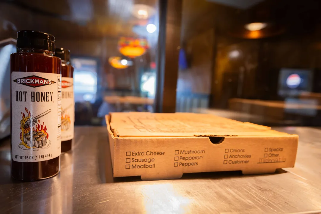 A hot honey pizza boxed and ready